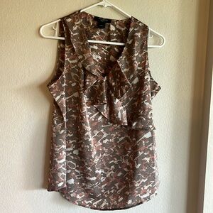 This is size 8 petite and Taylor top. Color is cream, gray